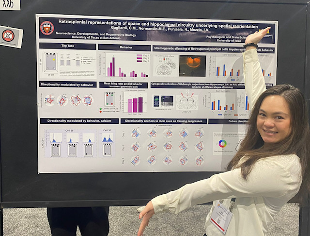 Celia Gagliardi in front of her poster at SFN